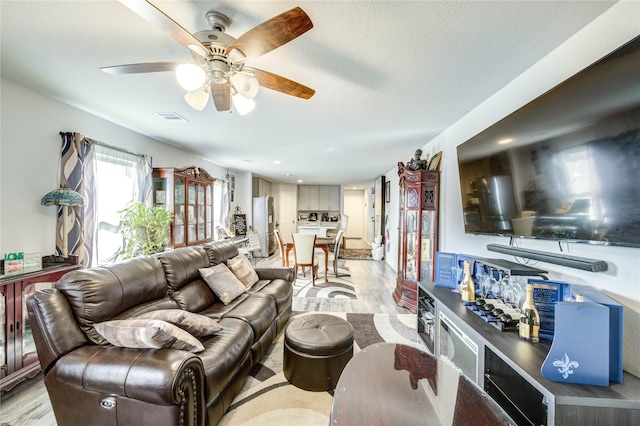 4338 Tulip Oak Dr, Houston, TX 77068 - living area featuring light wood-type flooring and a ceiling fan
