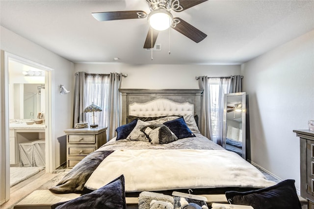 4338 Tulip Oak Dr, Houston, TX 77068 - bedroom with connected bathroom and ceiling fan