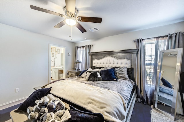 4338 Tulip Oak Dr, Houston, TX 77068 - carpeted bedroom with multiple windows, ensuite bathroom, and ceiling fan