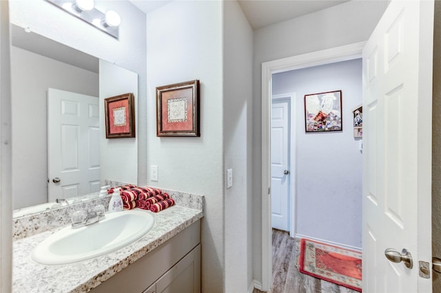 4338 Tulip Oak Dr, Houston, TX 77068 - bathroom featuring vanity and wood finished floors