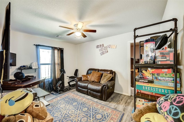 4338 Tulip Oak Dr, Houston, TX 77068 - office area featuring a ceiling fan, wood finished floors, and a textured ceiling
