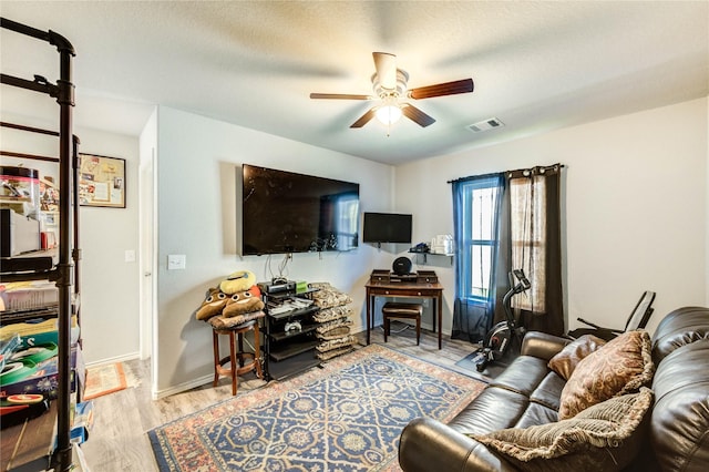 4338 Tulip Oak Dr, Houston, TX 77068 - living area featuring a ceiling fan, wood finished floors, and a textured ceiling