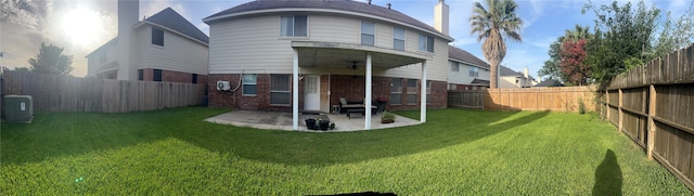 15415 Longhorn Cavern Dr, Sugar Land, TX 77498 - rear view of house with a ceiling fan, brick siding, a patio area, and a fenced backyard