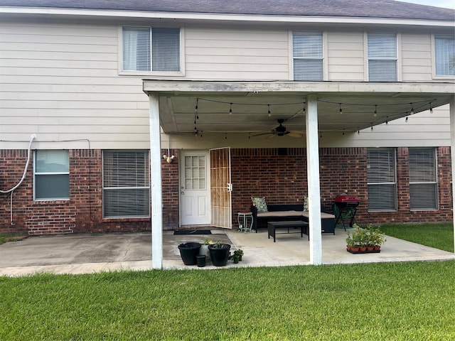 15415 Longhorn Cavern Dr, Sugar Land, TX 77498 - back of property with ceiling fan, a patio, brick siding, and a lawn