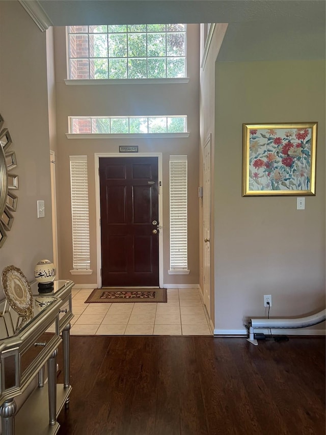 15415 Longhorn Cavern Dr, Sugar Land, TX 77498 - foyer entrance featuring a towering ceiling and light tile patterned floors