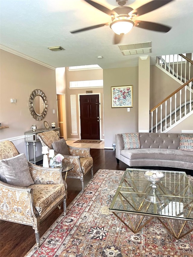 15415 Longhorn Cavern Dr, Sugar Land, TX 77498 - living room featuring wood finished floors, a ceiling fan, stairs, and ornamental molding