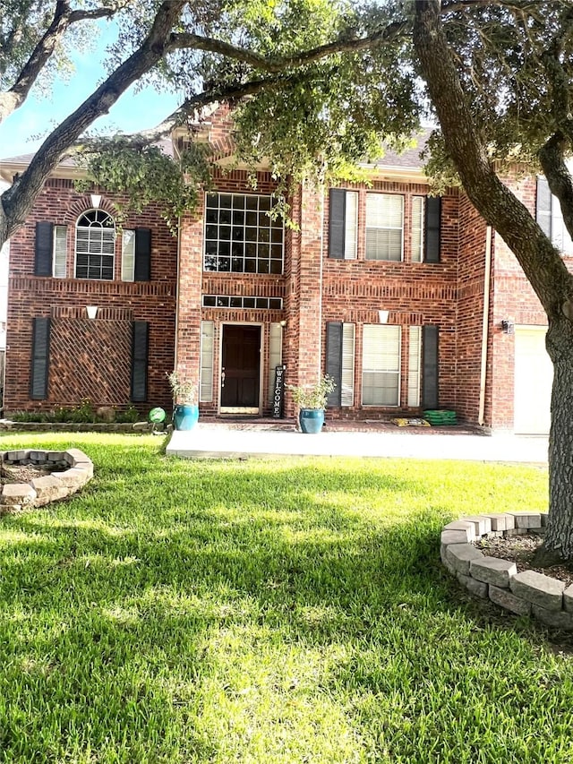 15415 Longhorn Cavern Dr, Sugar Land, TX 77498 - view of front of home with a front yard and brick siding