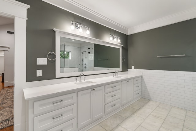 1114 Grovewood Ln, Houston, TX 77008 - bathroom featuring double vanity, a shower stall, crown molding, tile patterned floors, and tile walls