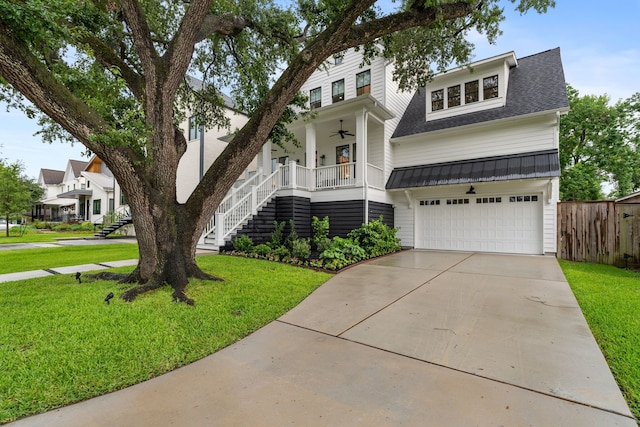 1114 Grovewood Ln, Houston, TX 77008 - view of front of house with stairway, a garage, ceiling fan, concrete driveway, and a shingled roof