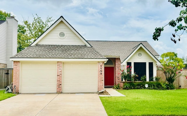 4418 Treasure Trl, Sugar Land, TX 77479 - view of front of home with a shingled roof, an attached garage, and brick siding