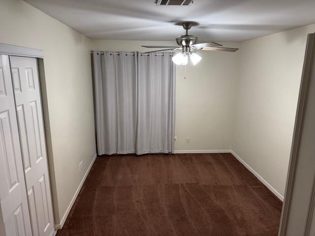 4418 Treasure Trl, Sugar Land, TX 77479 - empty room featuring dark carpet and a ceiling fan