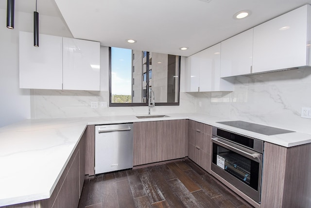 49 Briar Hollow Ln Unit 1106, Houston, TX 77027 - kitchen featuring appliances with stainless steel finishes, modern cabinets, dark wood-style floors, recessed lighting, and white cabinets