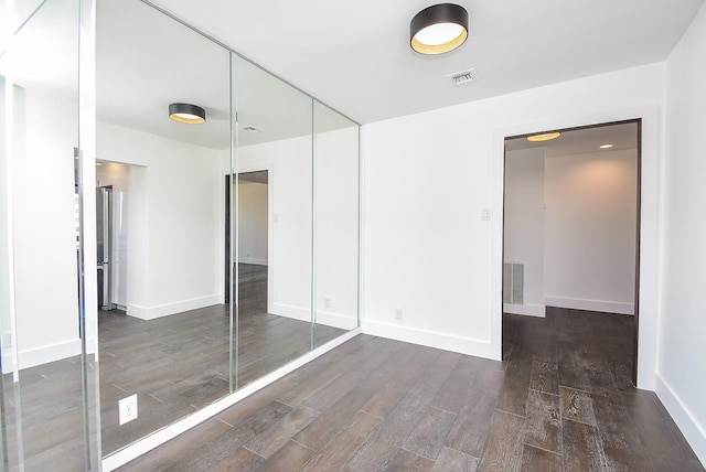 49 Briar Hollow Ln Unit 1106, Houston, TX 77027 - unfurnished bedroom with wood finished floors and a closet