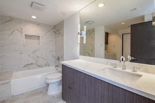 49 Briar Hollow Ln Unit 1106, Houston, TX 77027 - bathroom featuring washing machine and clothes dryer, vanity,  shower combination, and recessed lighting