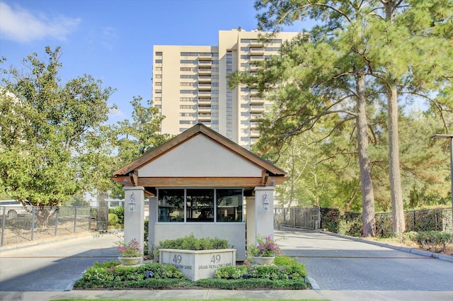 49 Briar Hollow Ln Unit 1106, Houston, TX 77027 - view of building exterior featuring driveway