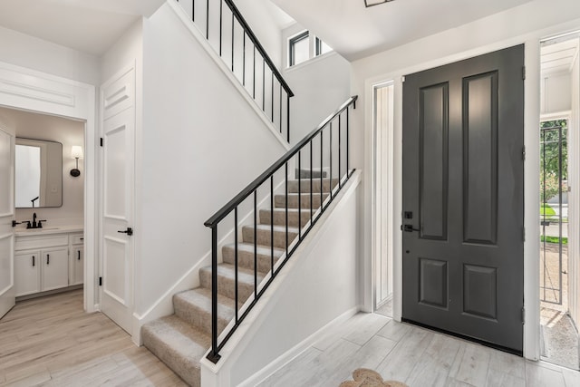 506 Fox Briar Ln, Sugar Land, TX 77478 - entryway with light wood-style floors, healthy amount of natural light, and stairs