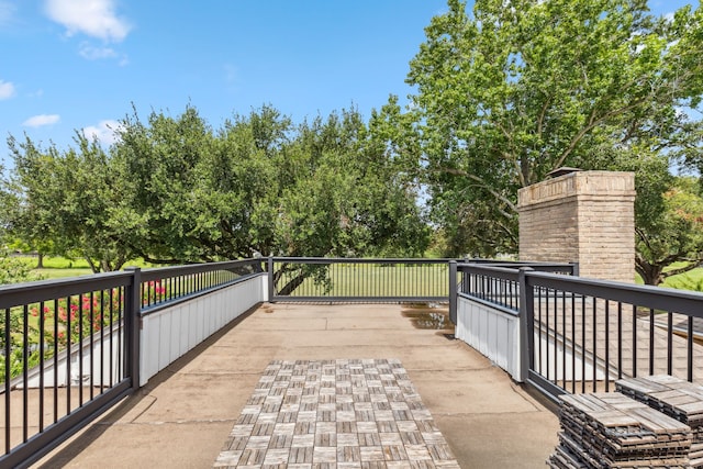 506 Fox Briar Ln, Sugar Land, TX 77478 - wooden deck with view of scattered trees