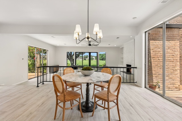 506 Fox Briar Ln, Sugar Land, TX 77478 - dining area with a chandelier, light wood finished floors, plenty of natural light, and recessed lighting