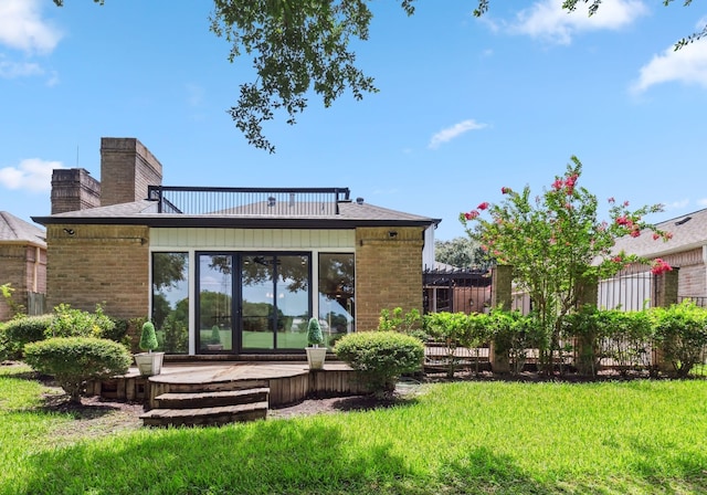 506 Fox Briar Ln, Sugar Land, TX 77478 - back of property featuring brick siding, a yard, and a chimney