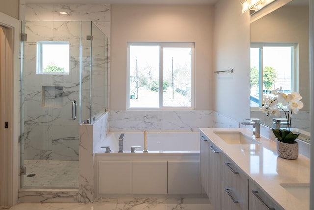 1912 Erastus St, Houston, TX 77020 - bathroom featuring a bath, marble finish floors, double vanity, and healthy amount of natural light