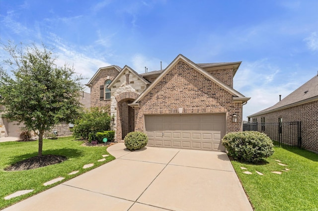 32647 Turning Springs Dr, Fulshear, TX 77423 - french country inspired facade with brick siding, a garage, driveway, and stone siding
