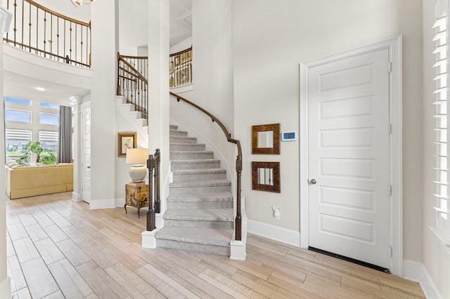 32647 Turning Springs Dr, Fulshear, TX 77423 - foyer with wood finished floors, stairway, and a high ceiling