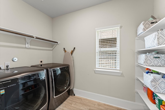 32647 Turning Springs Dr, Fulshear, TX 77423 - washroom featuring washer and dryer and light wood-style floors