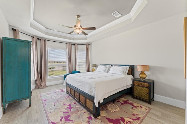 32647 Turning Springs Dr, Fulshear, TX 77423 - bedroom with ornamental molding, a raised ceiling, light wood-type flooring, and ceiling fan