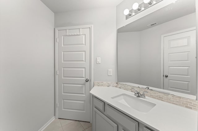 32647 Turning Springs Dr, Fulshear, TX 77423 - bathroom featuring vanity, tile patterned floors, and tasteful backsplash