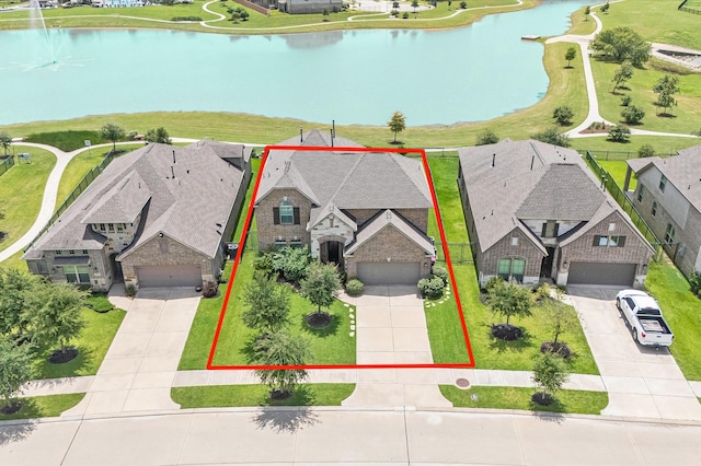 32647 Turning Springs Dr, Fulshear, TX 77423 - aerial perspective of suburban area with a nearby body of water and property boundaries highlighted