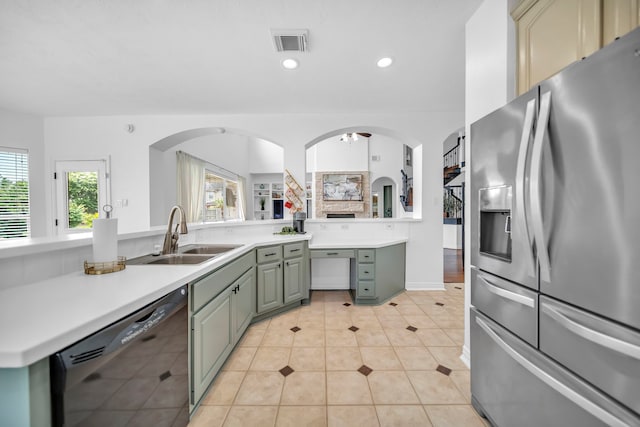 12702 Eagle Ledge Ln, Tomball, TX 77377 - kitchen with stainless steel fridge with ice dispenser, black dishwasher, plenty of natural light, light countertops, and recessed lighting