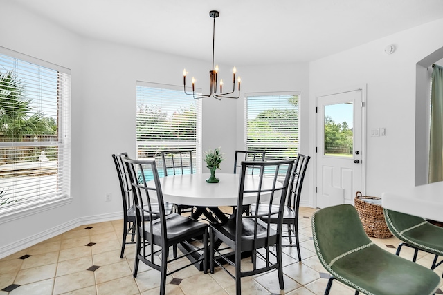 12702 Eagle Ledge Ln, Tomball, TX 77377 - dining room with a chandelier and light tile patterned flooring