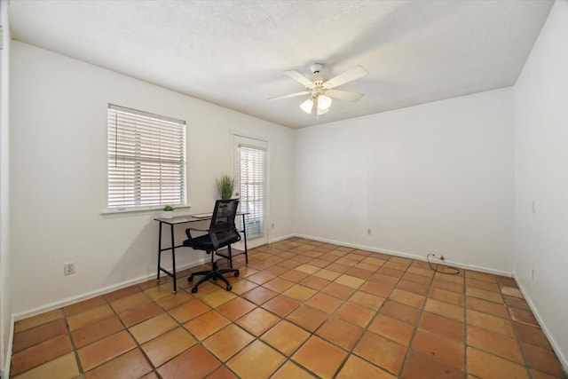 11937 Lakewood W Dr, Cypress, TX 77429 - home office with ceiling fan and light tile patterned floors
