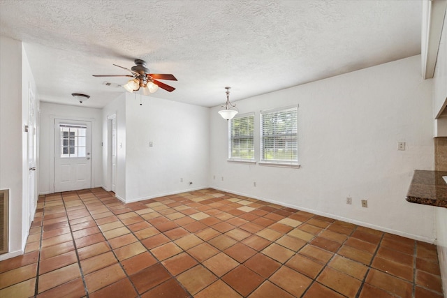11937 Lakewood W Dr, Cypress, TX 77429 - unfurnished living room with ceiling fan, tile patterned flooring, and a textured ceiling