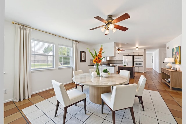 11937 Lakewood W Dr, Cypress, TX 77429 - dining area featuring a ceiling fan and light tile patterned flooring