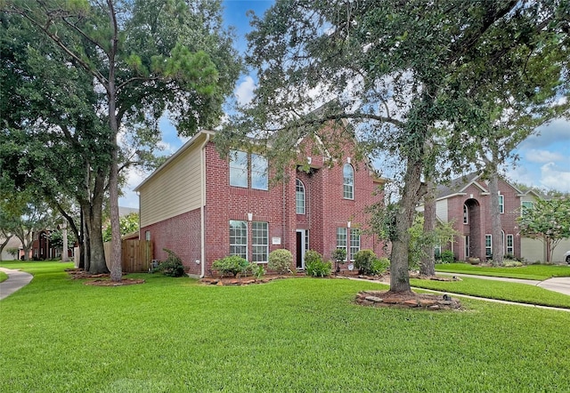 5403 Winlock Trace Ct, Katy, TX 77450 - view of front facade with brick siding and a front lawn