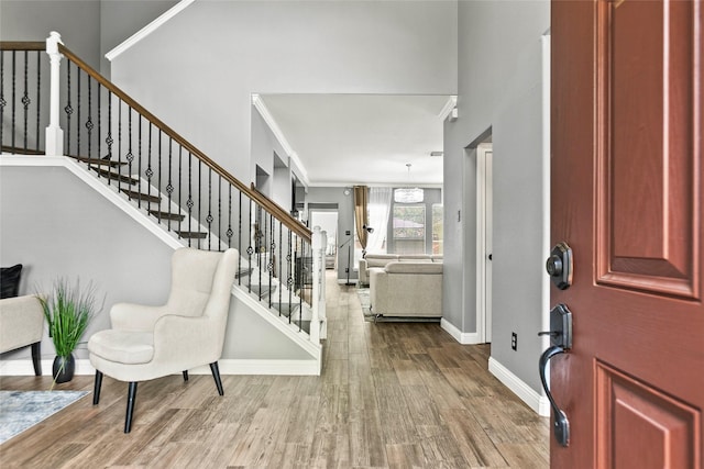 5403 Winlock Trace Ct, Katy, TX 77450 - foyer entrance featuring wood finished floors, stairway, and ornamental molding