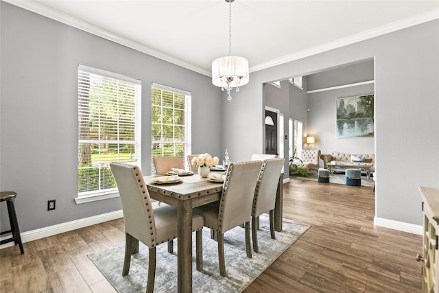 5403 Winlock Trace Ct, Katy, TX 77450 - dining space with crown molding, a chandelier, and wood finished floors