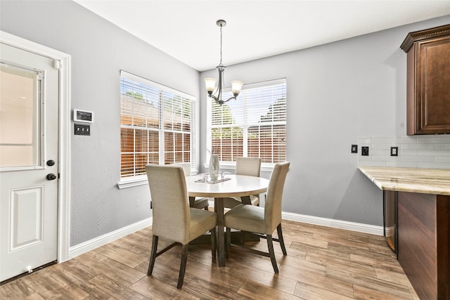 5403 Winlock Trace Ct, Katy, TX 77450 - dining room featuring wood finished floors and a chandelier