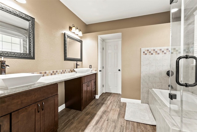 5403 Winlock Trace Ct, Katy, TX 77450 - full bath with wood finished floors, double vanity, a tile shower, and tiled bath