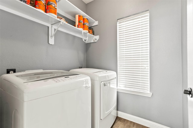 5403 Winlock Trace Ct, Katy, TX 77450 - laundry room featuring washing machine and dryer and wood finished floors