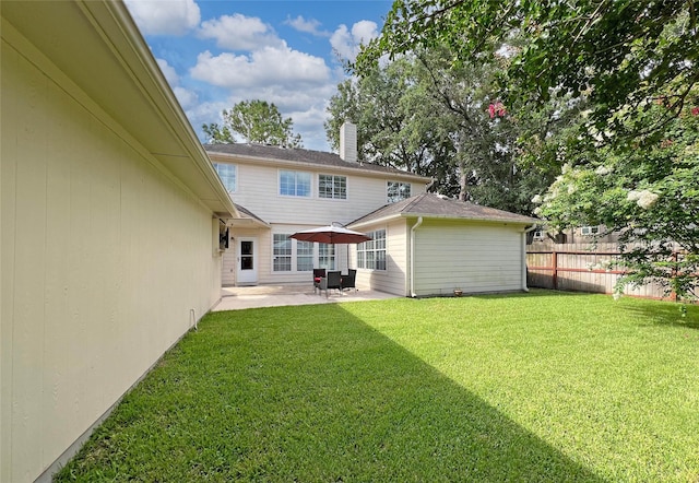 5403 Winlock Trace Ct, Katy, TX 77450 - back of property featuring a patio area and a chimney