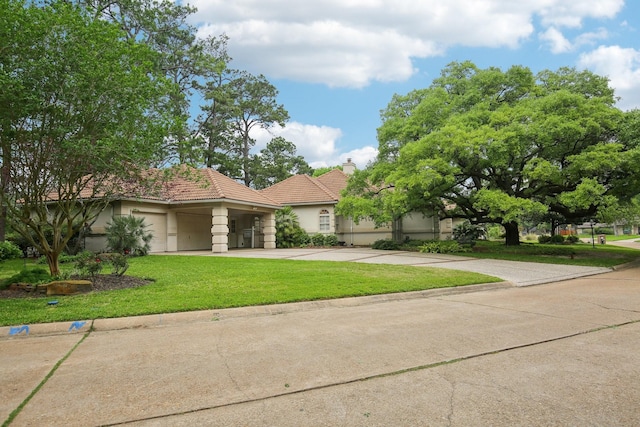 6230 Pebble Beach Dr, Houston, TX 77069 - view of front of house with a tiled roof, concrete driveway, stucco siding, and a front lawn