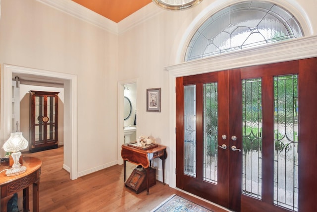 6230 Pebble Beach Dr, Houston, TX 77069 - foyer with wood finished floors, french doors, and crown molding