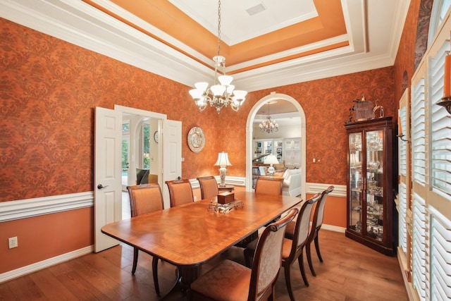6230 Pebble Beach Dr, Houston, TX 77069 - dining room with a chandelier, arched walkways, wood-type flooring, ornamental molding, and wallpapered walls