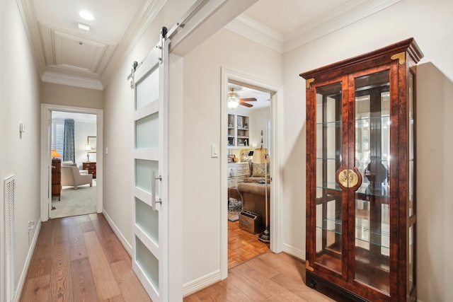6230 Pebble Beach Dr, Houston, TX 77069 - hall featuring a barn door, light wood finished floors, ornamental molding, and built in features