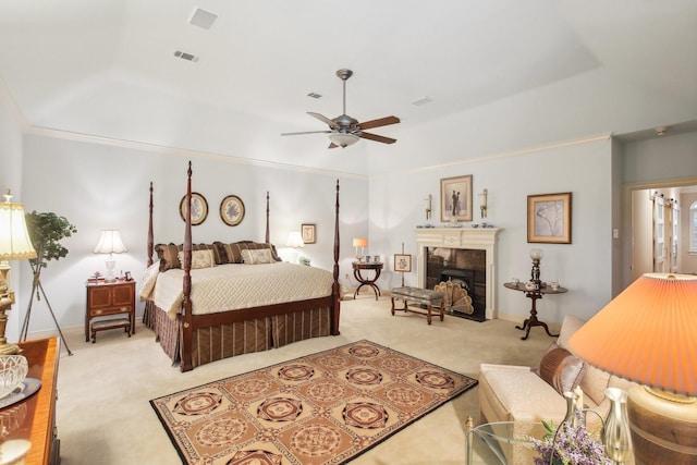 6230 Pebble Beach Dr, Houston, TX 77069 - bedroom featuring carpet flooring, a tiled fireplace, a raised ceiling, a ceiling fan, and crown molding