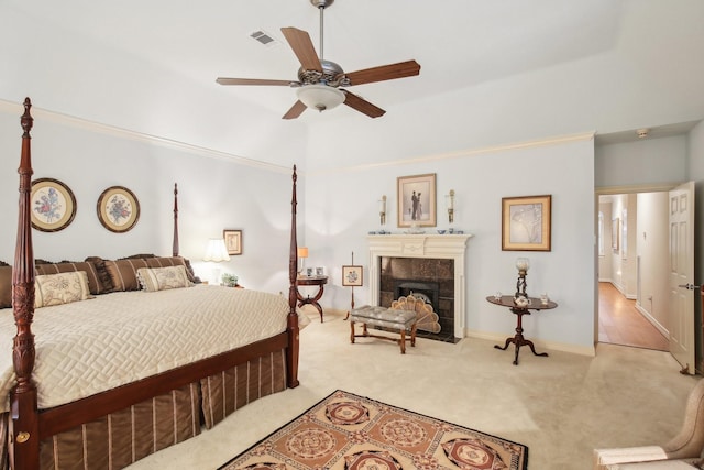 6230 Pebble Beach Dr, Houston, TX 77069 - bedroom with carpet flooring, a fireplace, and a ceiling fan