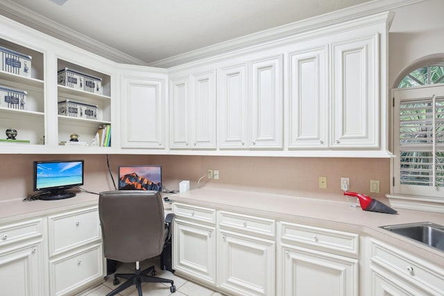 6230 Pebble Beach Dr, Houston, TX 77069 - office featuring built in desk, crown molding, and light tile patterned flooring