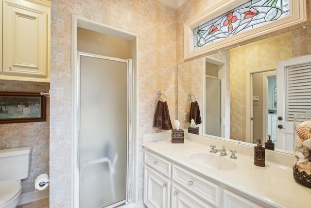 6230 Pebble Beach Dr, Houston, TX 77069 - bathroom featuring wallpapered walls, vanity, and a shower stall